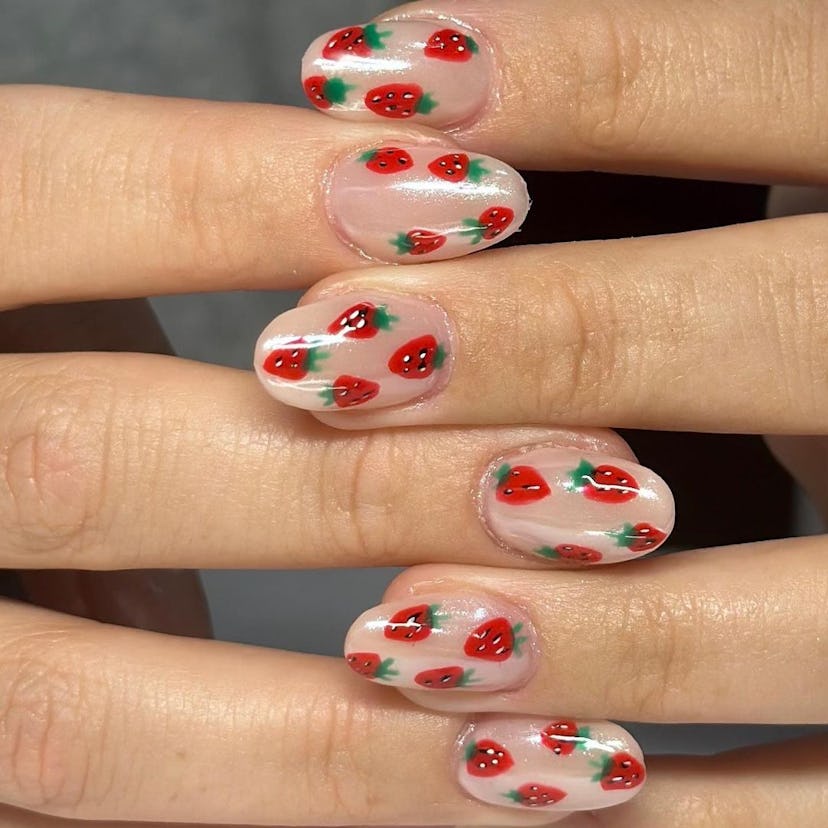 Strawberry nail art on short almond nails are on-trend for 2024.