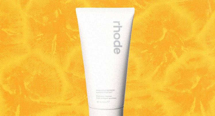 a bottle of rhode's cleanser against a yellow background