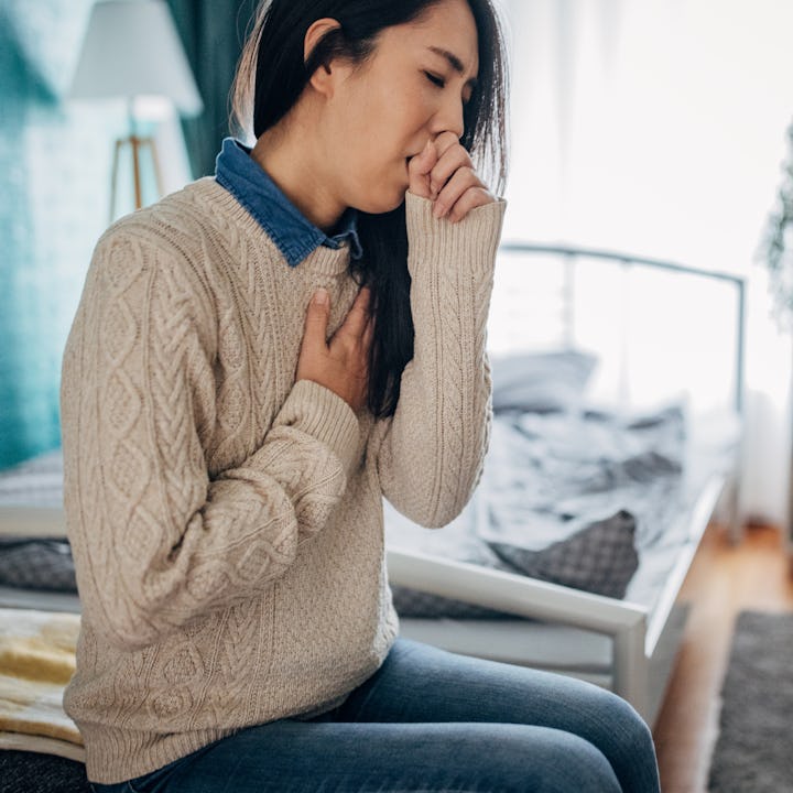 A woman struggles with a lingering cough.