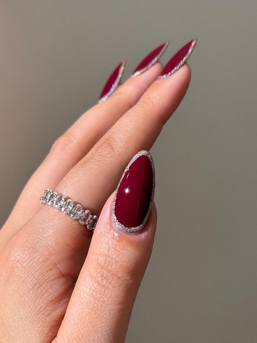 Cherry mocha nails with silver outlines match the mob wife aesthetic.