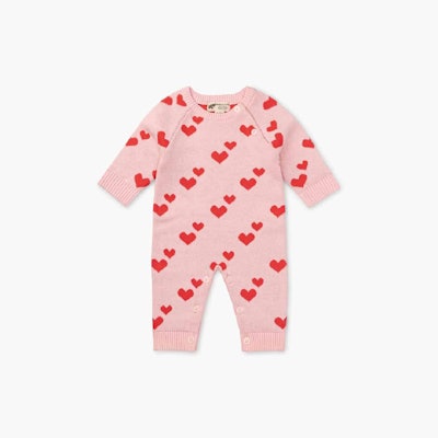 pink Sweater Romper with red hearts, a warm baby's first valentine's day outfit.