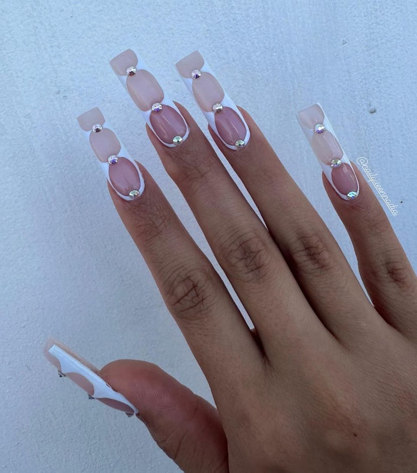 White hourglass nails on long nails match the mob wife aesthetic.