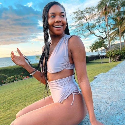 Gabrielle Union side parted braids in bathing suit