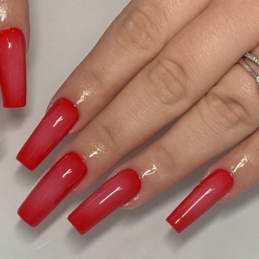 Vibrant red aura nail art matches the mob wife aesthetic.