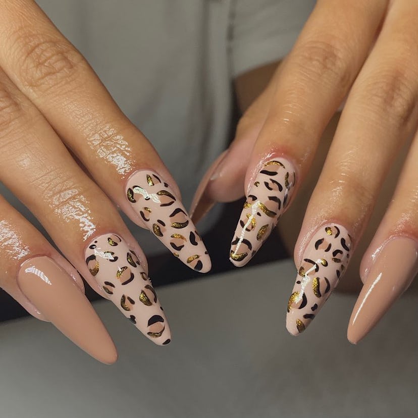 Leopard print nails match the mob wife aesthetic.