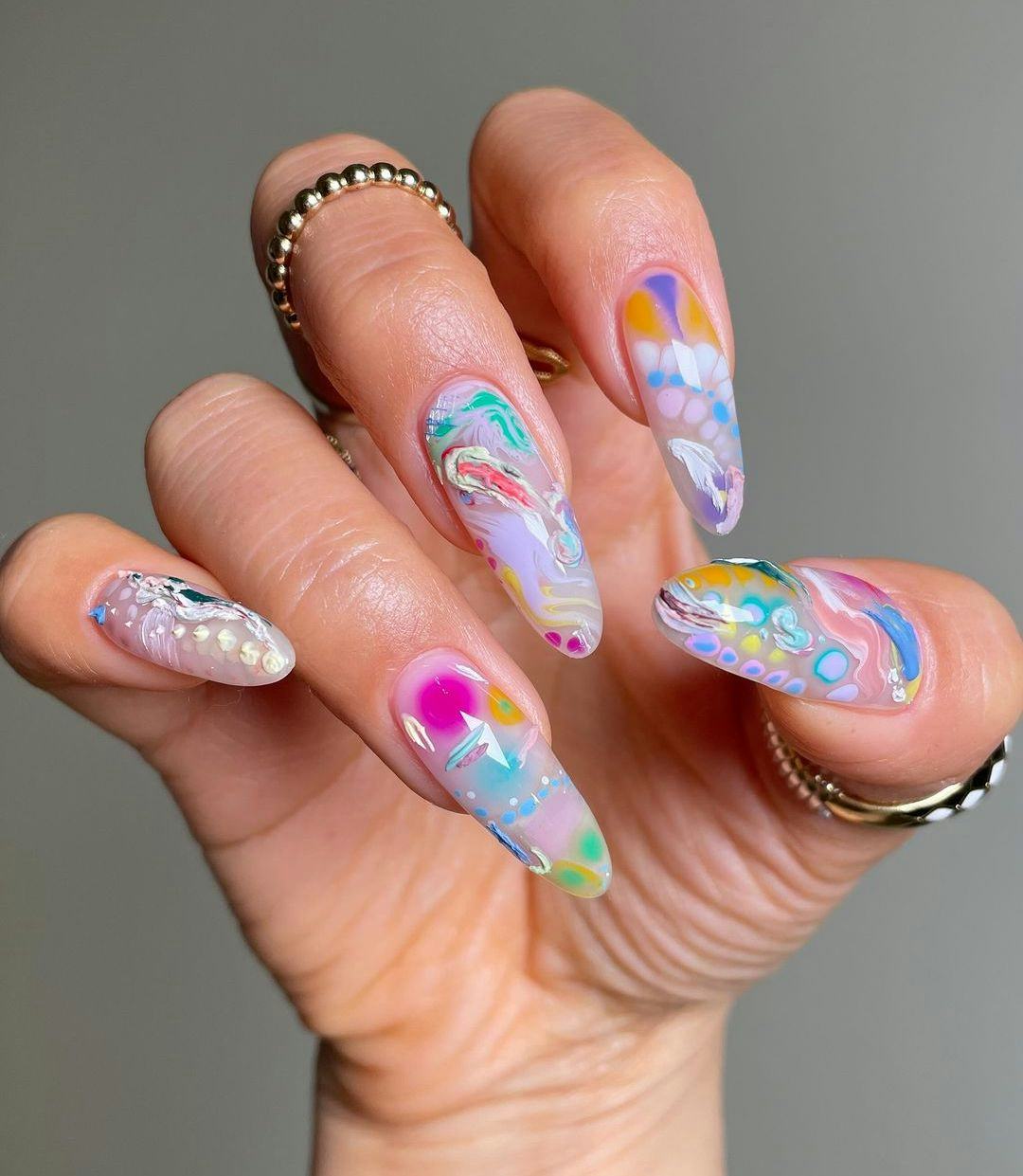 Creative paint-swatch nail art details are on-trend for 2024&rsquo;s Aquarius season.
