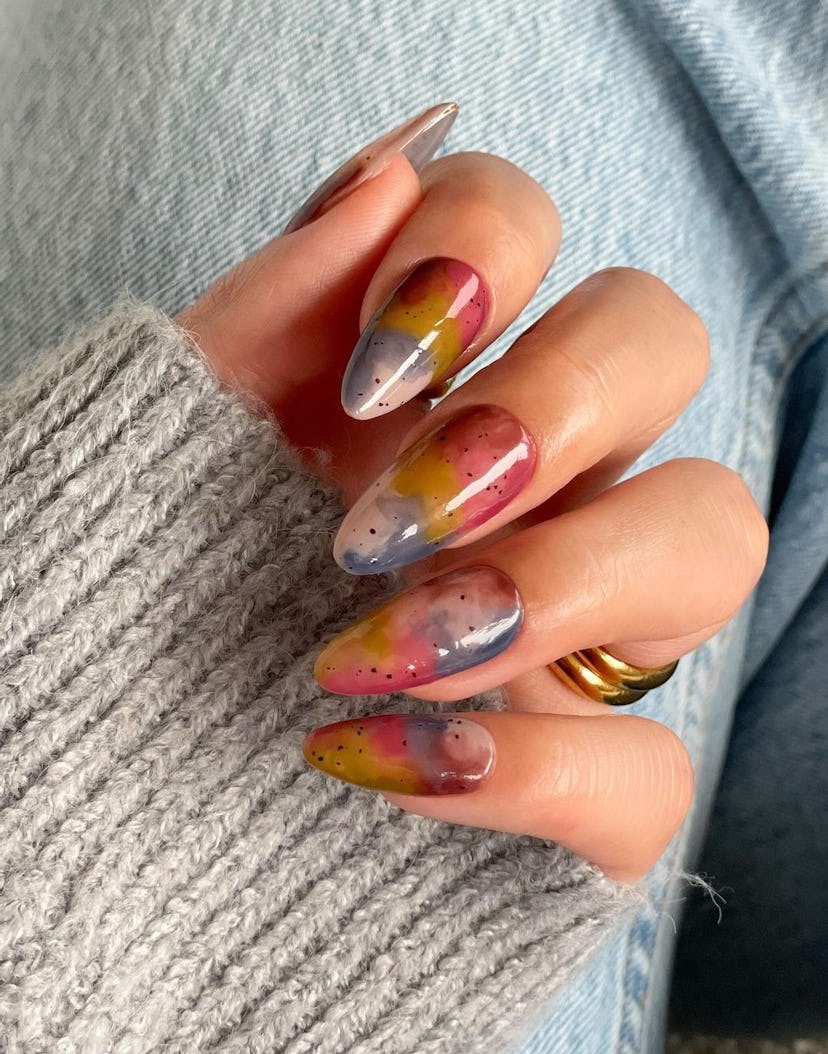 Whimsical watercolor-inspired nail designs are on-trend for 2024’s Aquarius season.