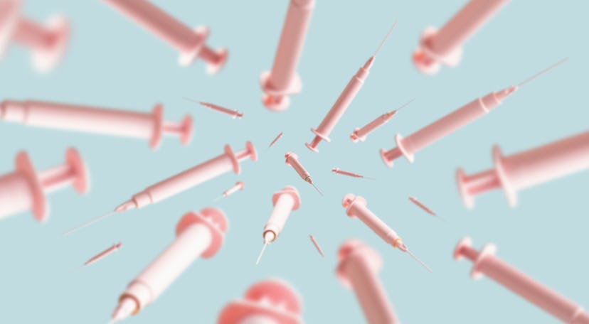 multiple pink syringes in mid-air on a light blue background