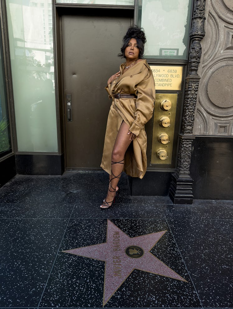 Taraji P. Henson wears a Max Mara coat and belt; Bulgari necklace; Christian Louboutin sandals.