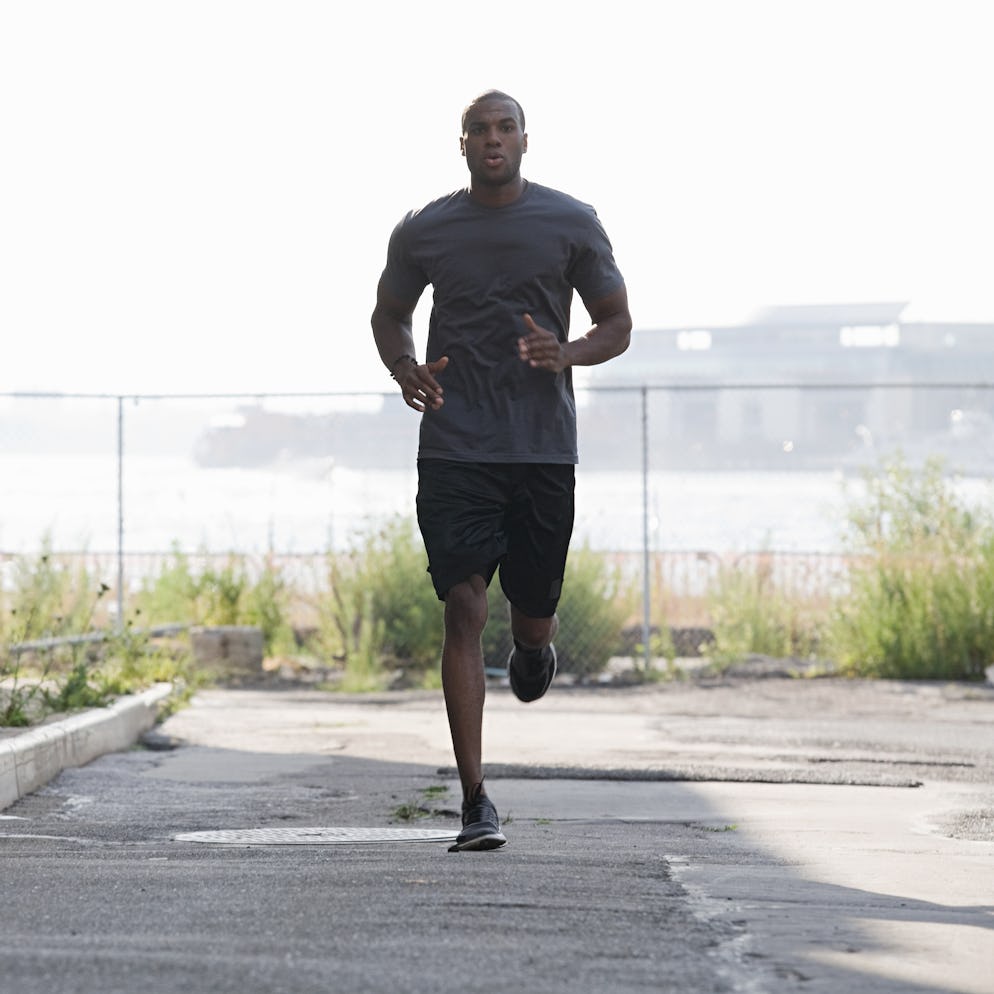 A man doing a fartlek run outdoors.