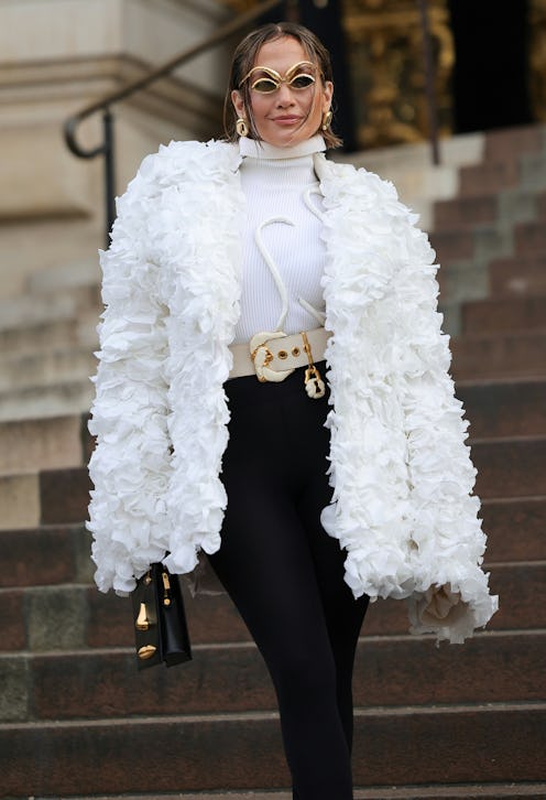 Jennifer Lopez attends the Schiaparelli Haute Couture Spring/Summer 2024 show in Paris in a white co...