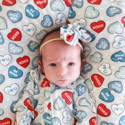 blue and red "be mine" sweetheart print bow, a perfect accesory for baby's first valentine's day out...