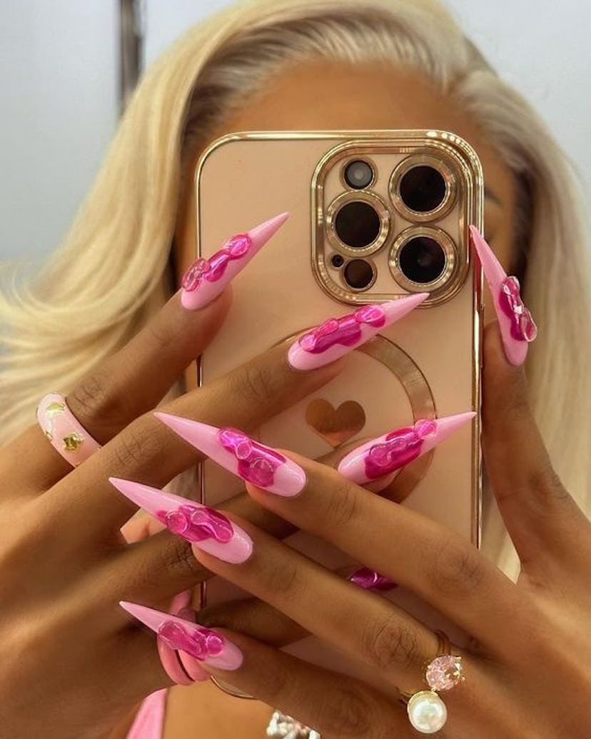 Extravagant nail art details on long nails are on-trend for 2024.