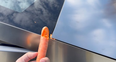 Cybertruck's frunk closing on a carrot.
