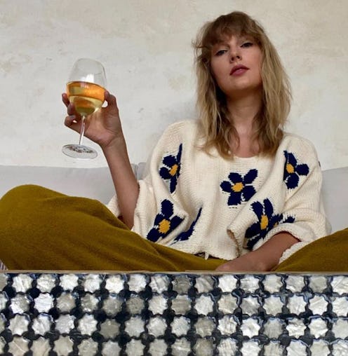 Taylor Swift nail color drinking wine