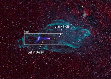 color image of a green cloud of gas in space with x-ray jets in purple