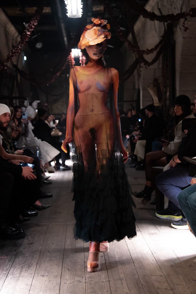 a look from maison margiela by john galliano artisanal couture spring 2024 shown in paris