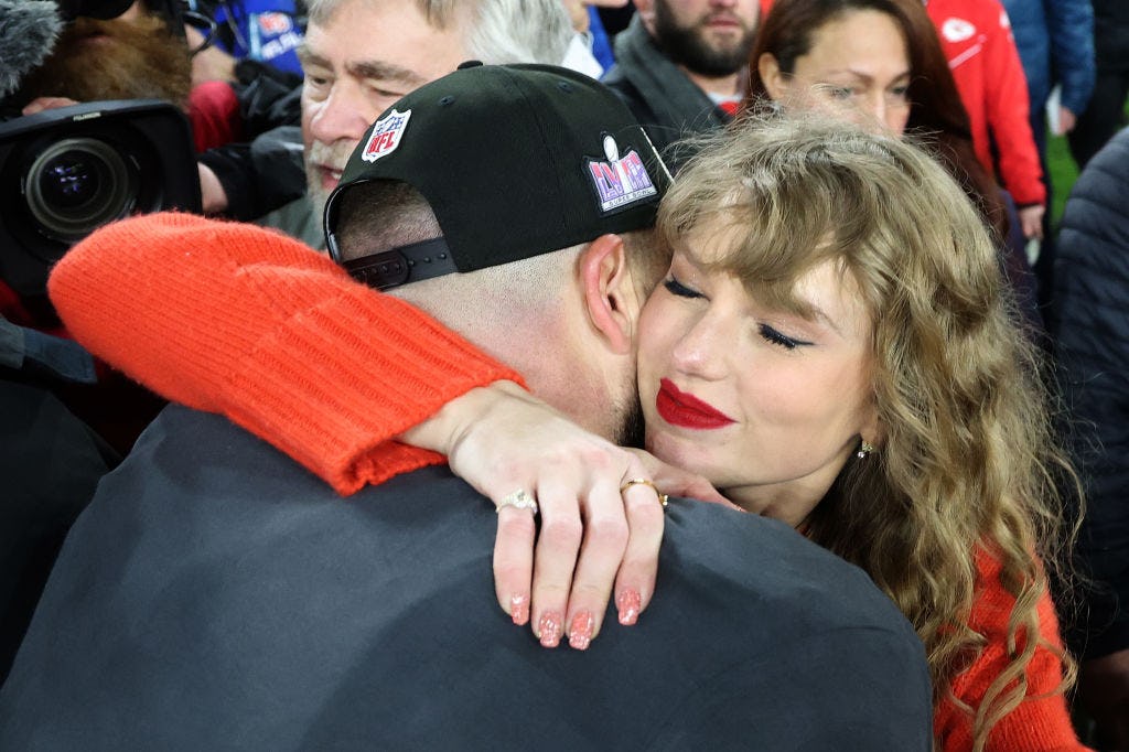 Taylor Swift&rsquo;s 2024 Chiefs playoffs makeup look featured a red lip and shimmery eyeshadow.