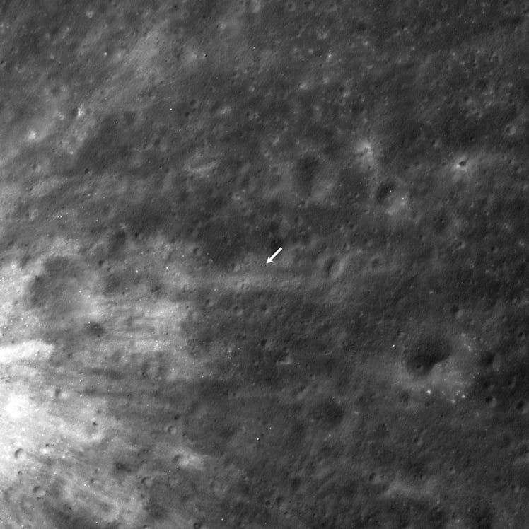 The middle of this birds-eye view of the Moon features an arrow that indicates where SLIM landed. Th...