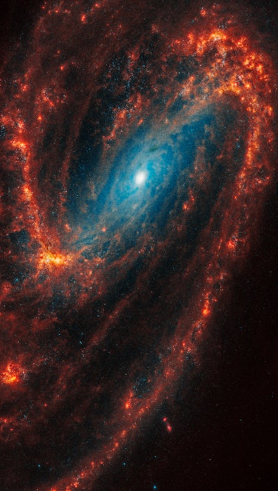 Webb’s image of NGC 3627 shows a face-on barred spiral galaxy anchored by its central region, which ...