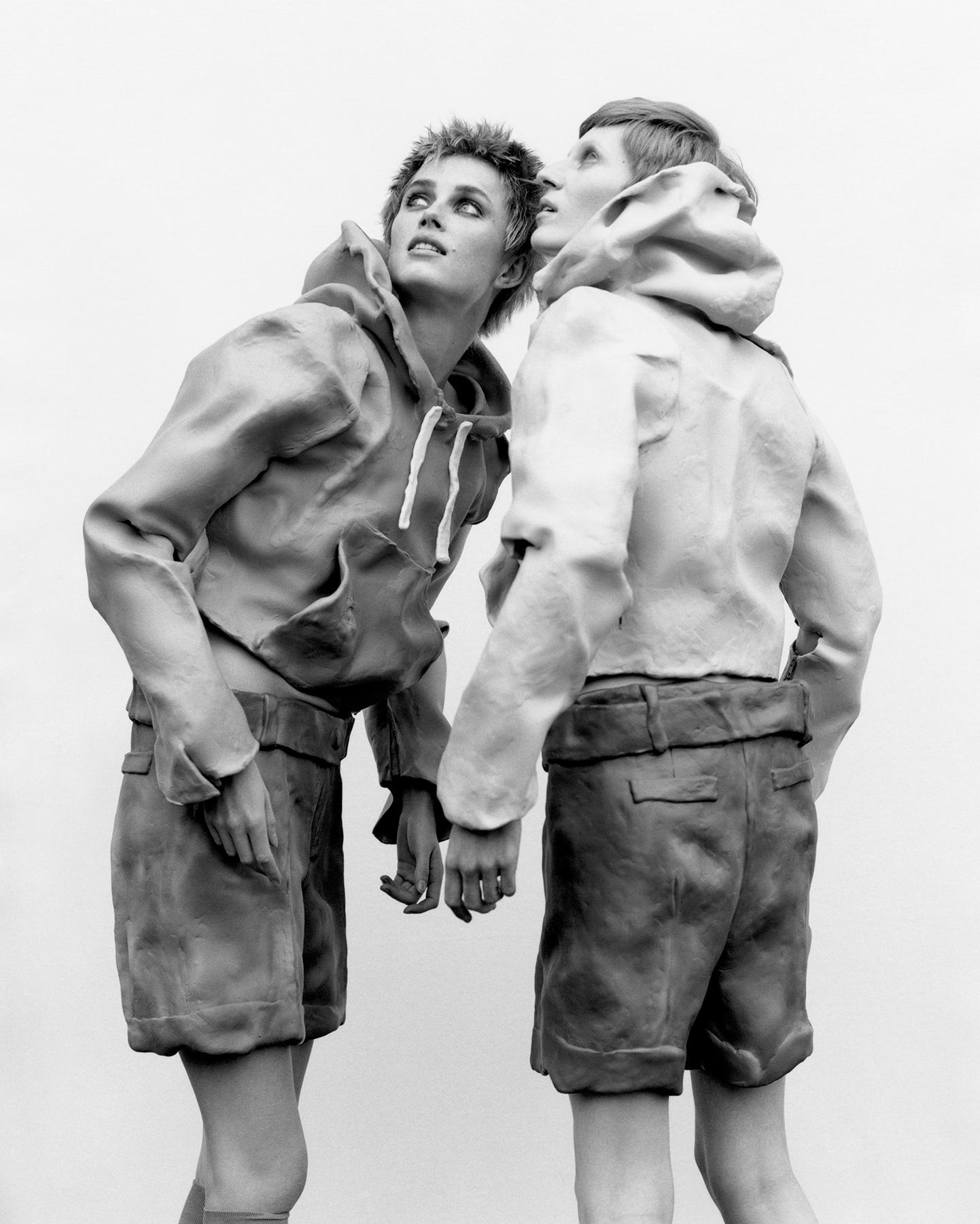 From left: Rianne Van Rompaey and Julia Nobis wear JW Anderson hoodies and shorts.