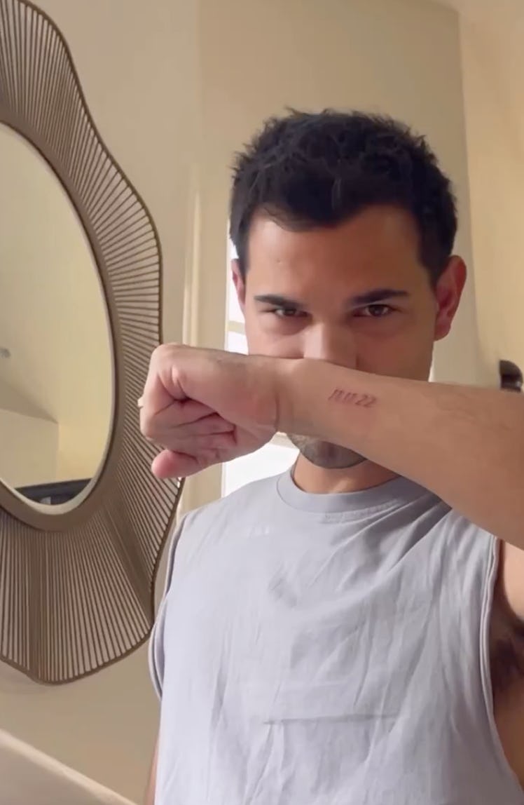 Taylor Lautner's matching wedding date tattoo with Tay Lautner