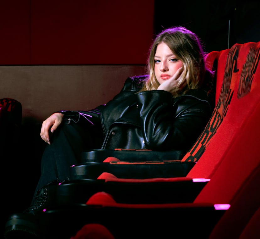 Francesca Scorsese in a movie theater seat in a photo shoot for NYLON January It Girl
