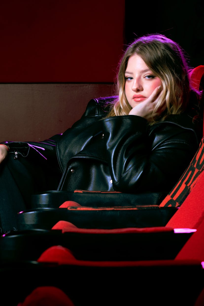 Francesca Scorsese in a movie theater seat in a photo shoot for NYLON January It Girl