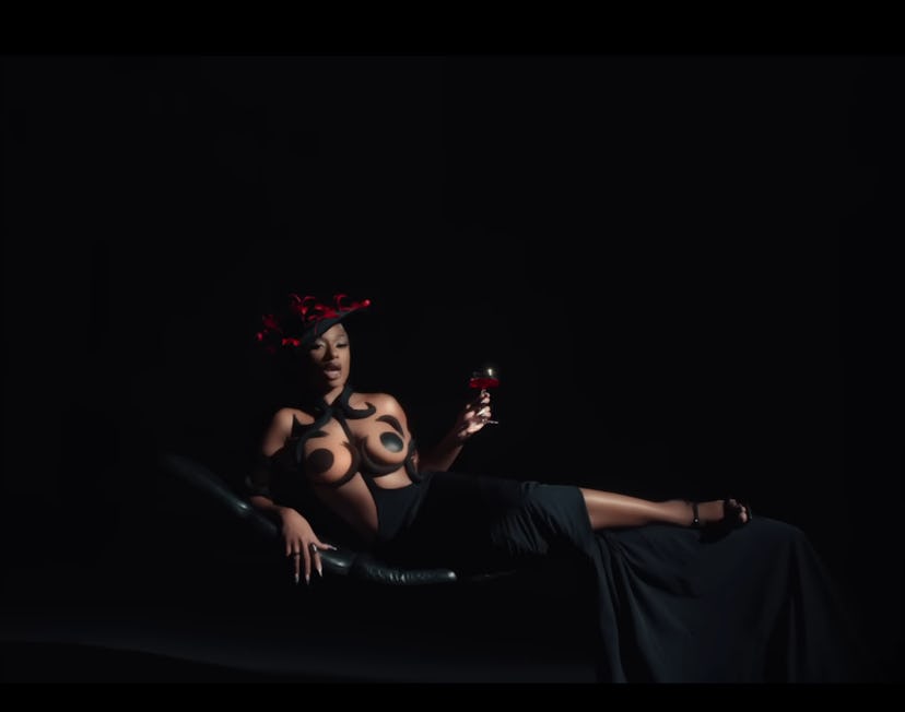 Megan Thee Stallion wore a hat adorned with red spider lilies in the “Hiss” music video.