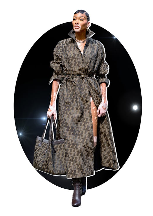 winnie harlow wears a monogram fendi trench coat