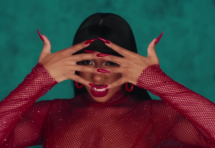 Megan Thee Stallion wore stiletto-shaped red nails in the “Hiss” music video.