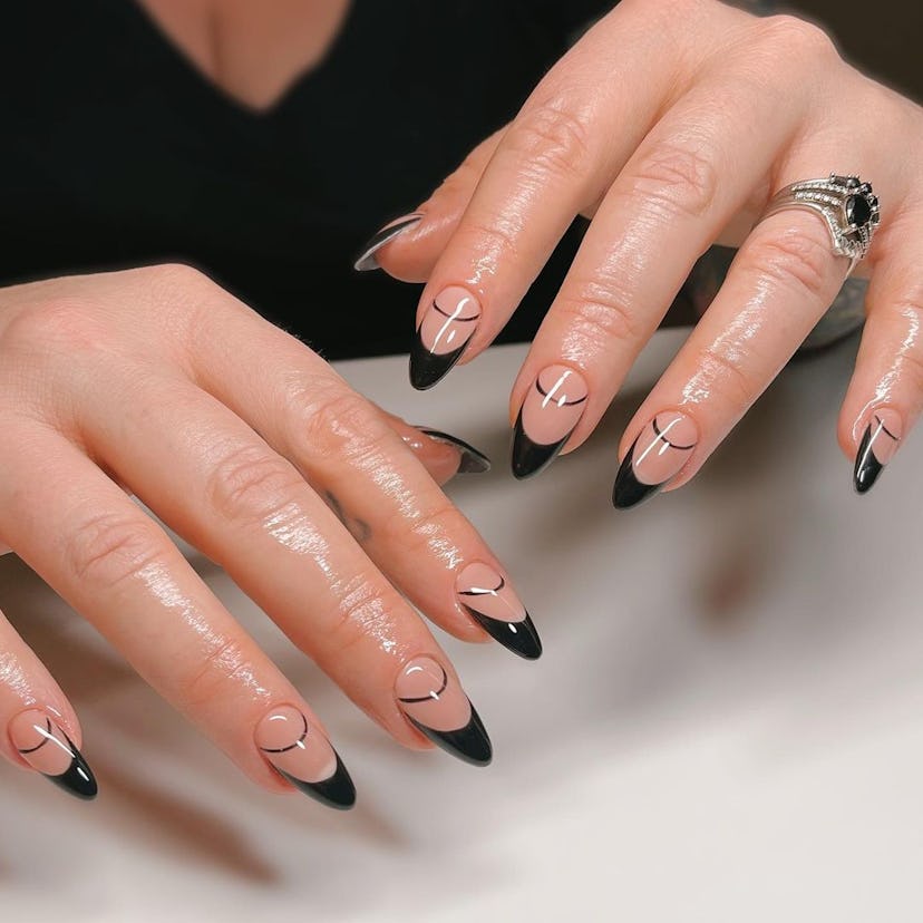 Double-lined black French tip nails are on-trend for 2024.