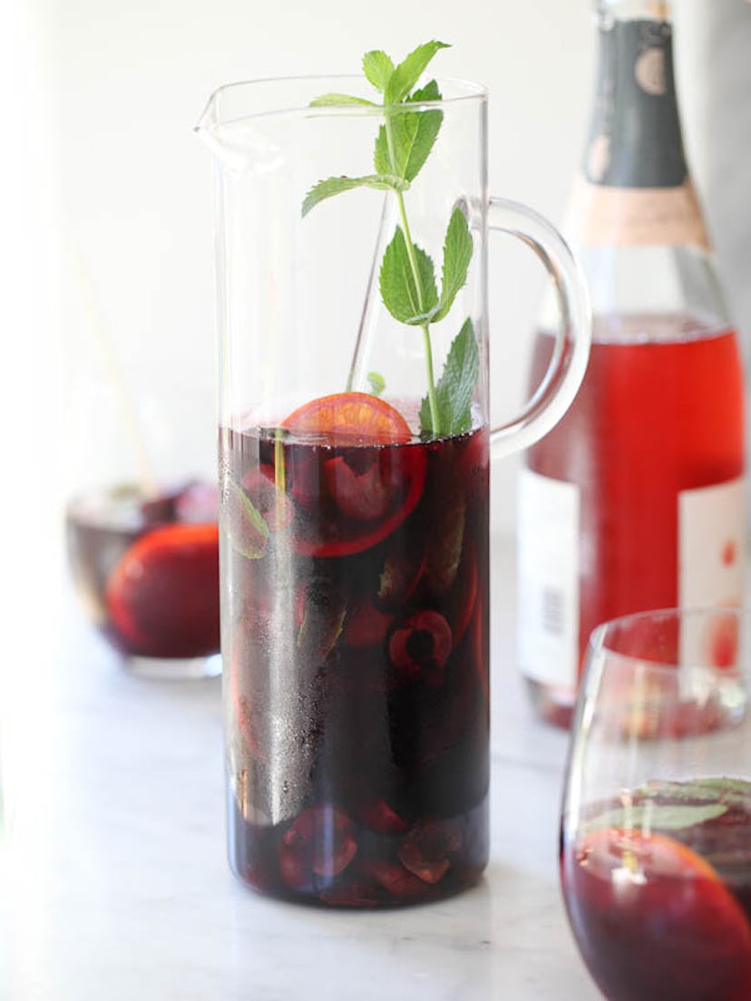 Red sangria made with roasted cherries, a festive Valentine's Day cocktail