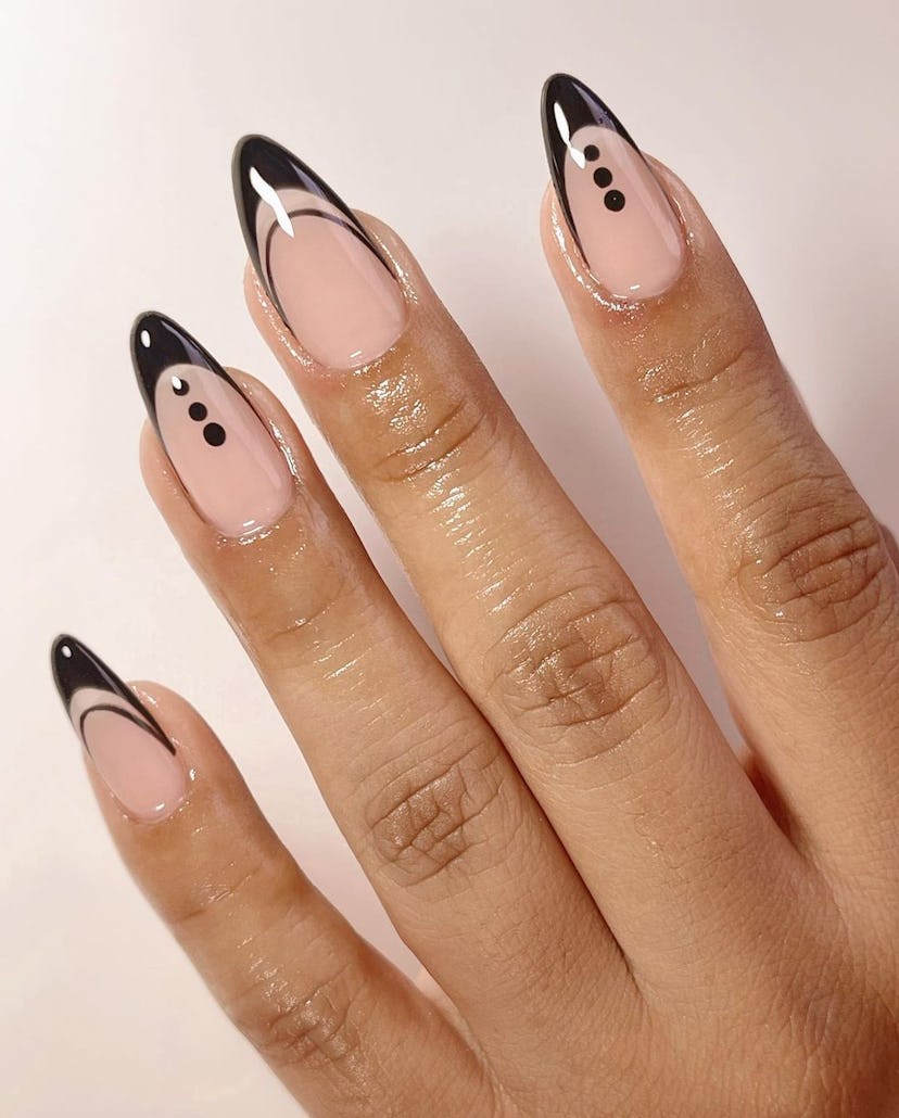Invisible French nails with dot details are on-trend for 2024.