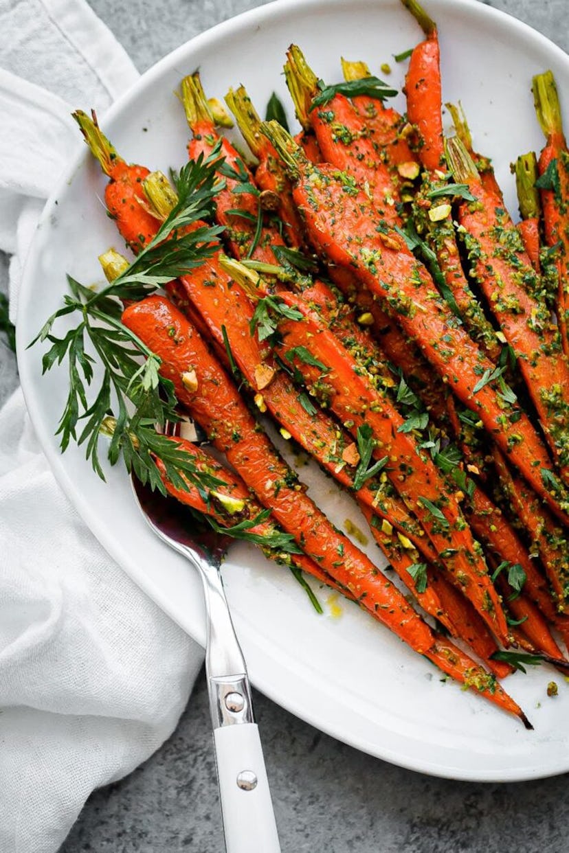 Roasted carrots with pesto, a perfect side for your at-home Valentine's Day dinner ideas.