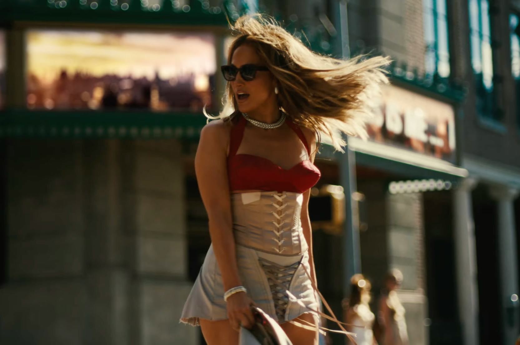 Jennifer Lopez wears a red bra and corset in the &ldquo;Can&rsquo;t Get Enough&rdquo; feat. Latto remix video.