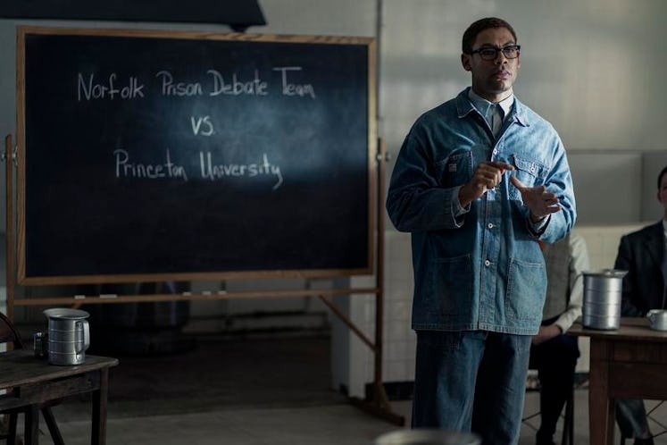 Malcolm X, played by Aaron Pierre, speaks during a debate from prison as seen in GENIUS: MLK/X.