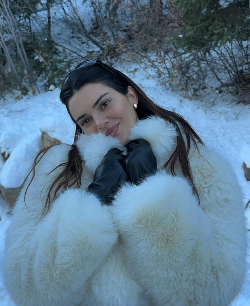 Kendall Jenner wears a white fur coat from Alo in Aspen, Colorado