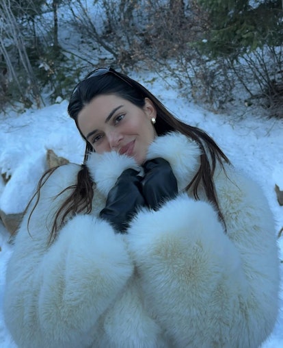 Kendall Jenner wears a white fur coat from Alo in Aspen, Colorado
