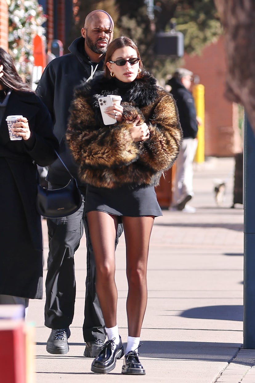 Hailey Bieber wears a cropped Ferragamo fur coat in Aspen, Colorado
