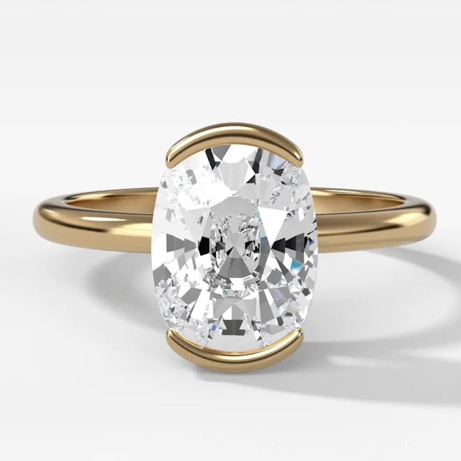 Half Bezel Solitaire Engagement Ring With Elongated Cushion Cut Diamond