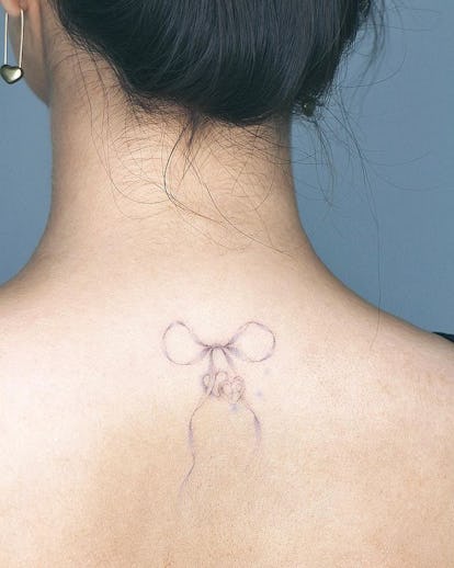 13 Adorable Coquette Tattoo Ideas Inspired by Hailey Bieber's Dainty Bow 35 Ballerina tattoo.