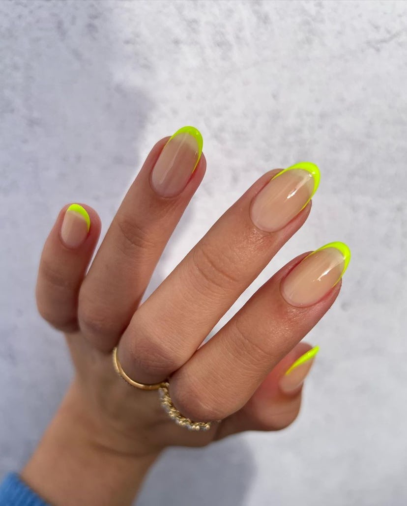 Neon French tips are a trendy French manicure idea for 2024.