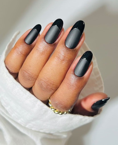 Black patent leather French tips are a trending French manicure idea for 2024.