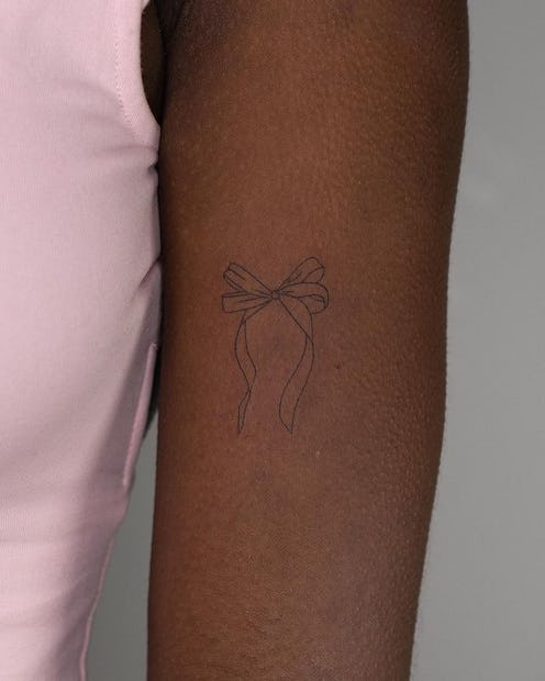 Flirty coquette tattoo ideas inspired by Hailey Bieber's bow. 