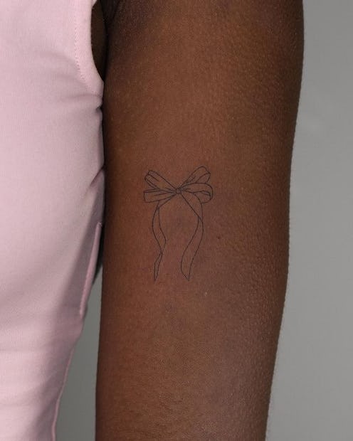 Flirty coquette tattoo ideas inspired by Hailey Bieber's bow.