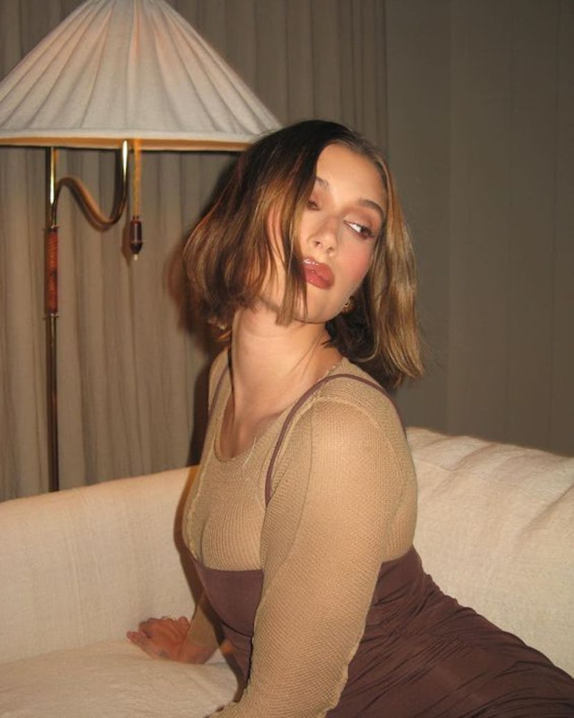 Brunette hair with subtle cinnamon tones is a popular winter hair color trend for 2024.