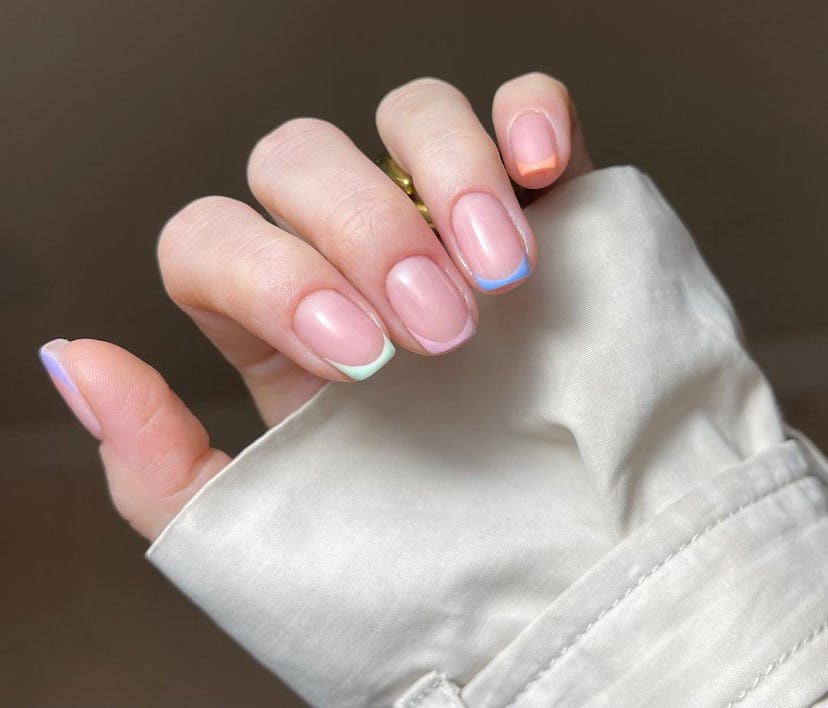 Colorful Skittle French tips are a trendy French manicure idea for 2024.