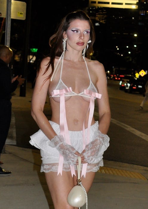 Julia Fox wears a bra with pink bows and coquette bloomers.