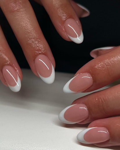 The classic white French tip is the trending French manicure idea for 2024.